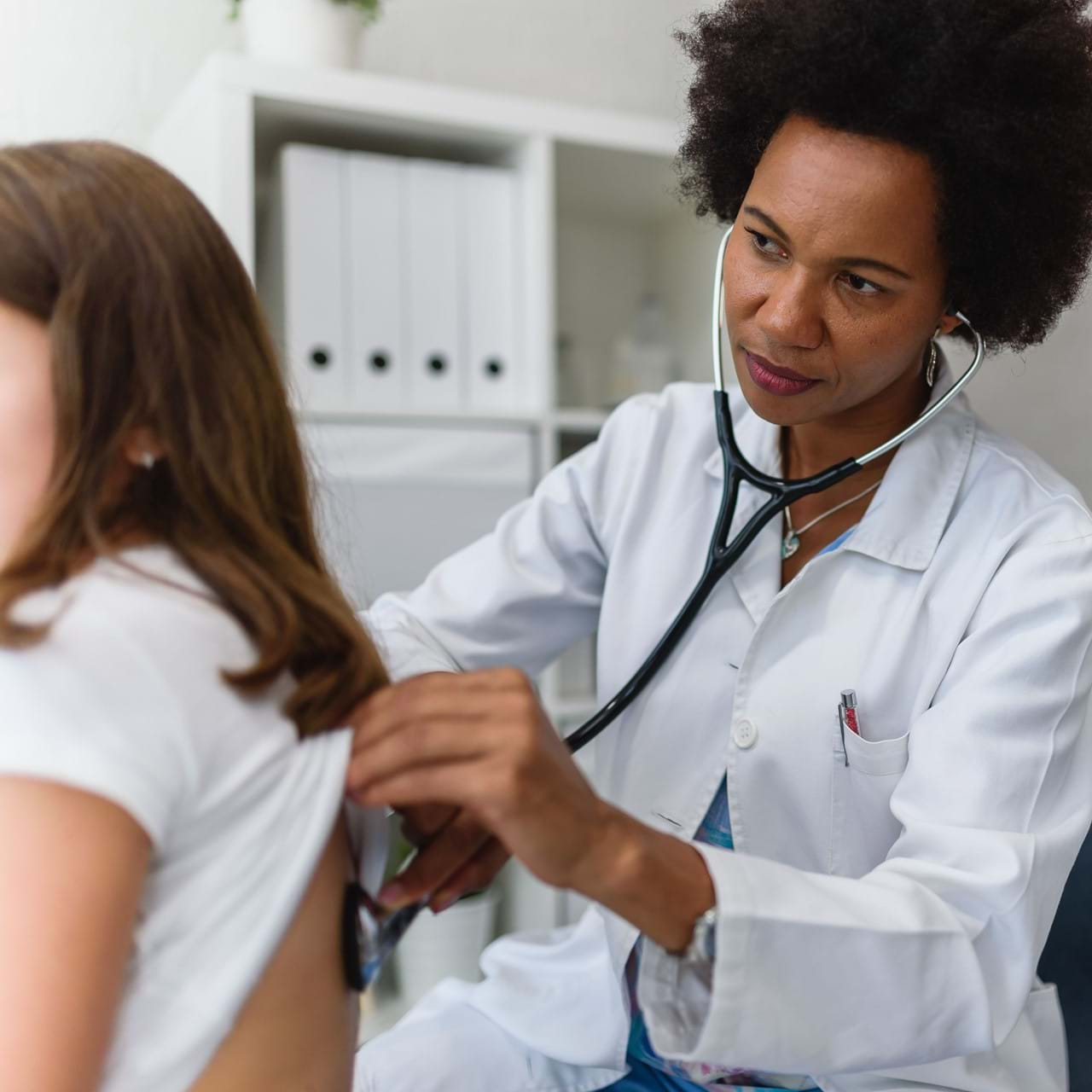 Doctor Listening to Patient Breathing